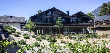 Bau von 21 Häusern für ein Hotel in Garmisch-Partenkirchen